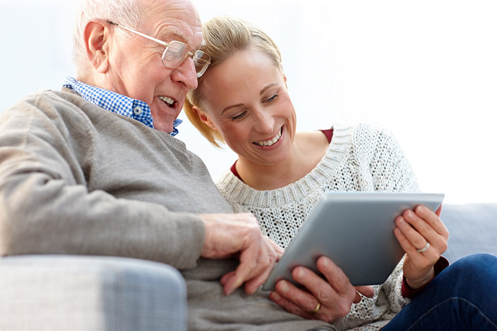 Father and daughter with Ipad