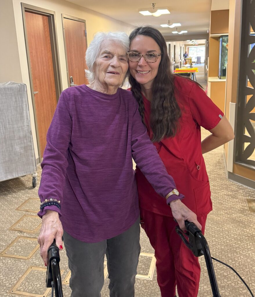 Nurse and Resident Smiling